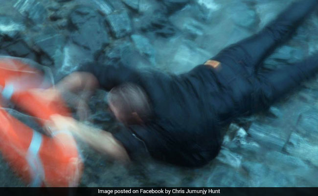 man dog rescued from sea uk 650