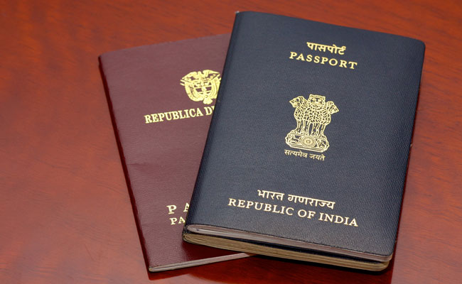 Passports To Stay Blue, Retain Address. Government Drops Plan Orange