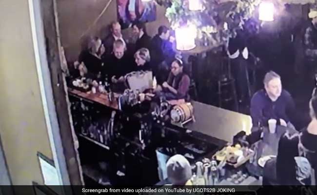 Video Shows Police Officer Hitting His Wife At Bar With Cellphone