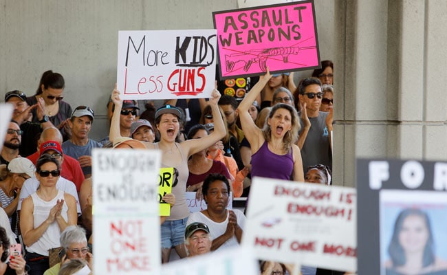 Firearms Debate Rages As Florida Anti-Gun Rally Coincides With Gun Show