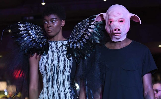 #MeToo Themed New York Fashion Show Opens With Angel Wing Models, Pig-Faced Men