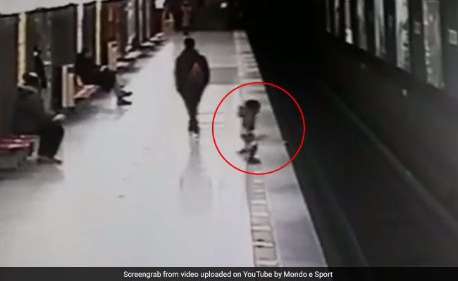 Video: Train Just A Minute Away, Child Falls On Tracks. Saved By Stranger
