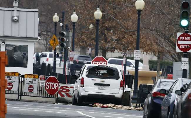 Vehicle Strikes White House Barrier, Driver Detained