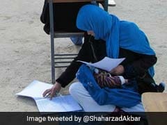 Afghan Woman Takes Exam While Nursing Her Baby. Incredible Pic Is Viral