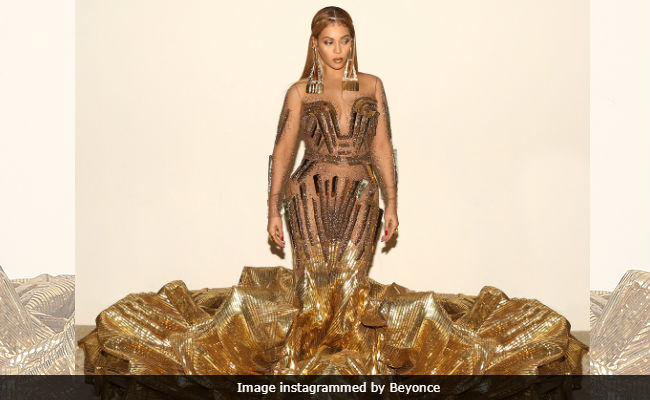 Beyonce's Giant Gold Dress Was Made By Indian Designers Falguni & Shane Peacock