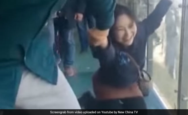 Too Scared To Walk, Tourist Dragged Across 500-Metre-High Glass Bridge