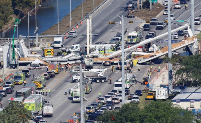 4 People Killed When New Pedestrian Bridge Collapses Near Miami, Crushing Eight Cars Underneath