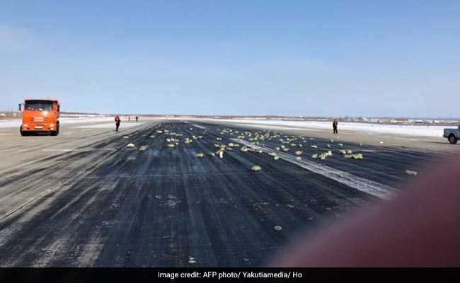 Gold, Platinum Bars Spill Across Russian Runway As Plane Door Flies Open