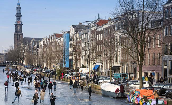 Locals Go Ice Skating As 'Beast From The East' Freezes Amsterdam's Canals