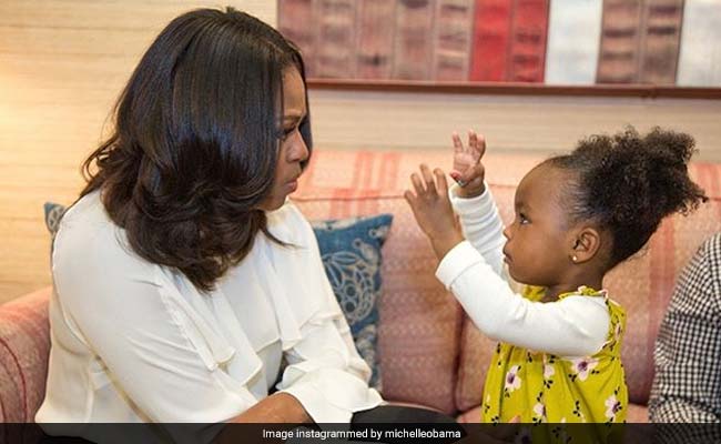 Her Photo Admiring Michelle Obama's Portrait Went Viral. They Just Met