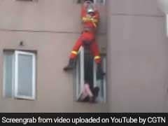 Video: Firefighter Saves Suicidal Woman By Kicking Her Back Into Home