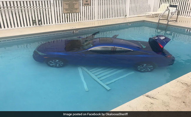 Woman Forgets To Put Car In Park. It Rolls Into Pool With Family Inside