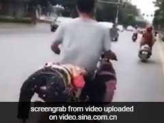 Caught On Camera: She Refused To Go To School, So Dad Tied Her Onto Bike