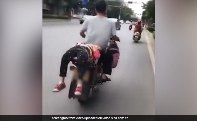 Caught On Camera: She Refused To Go To School, So Dad Tied Her Onto Bike