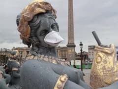 French Statues Get Anti-Pollution Masks In Clean Air Protest