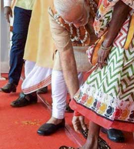 PM Modi's Picture Perfect Moment With Slippers For Tribal Woman At Rally