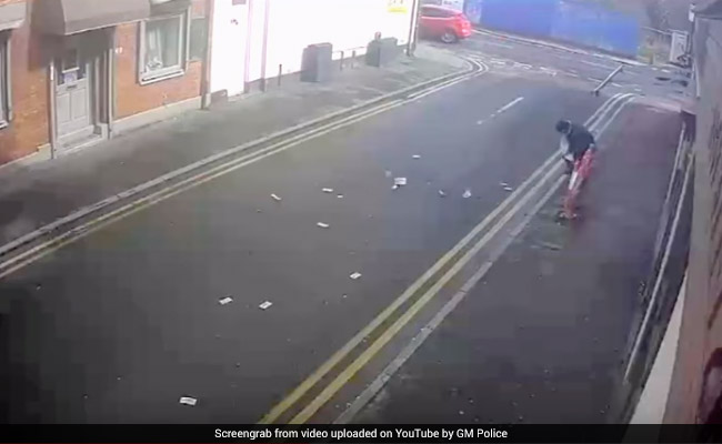 Wind Blows Away Robber's Stolen Cash, He Helplessly Chases After. Watch