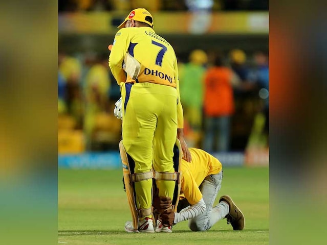 Watch: MS Dhoni Fan Runs Onto The Pitch And Falls At CSK Captains Feet
