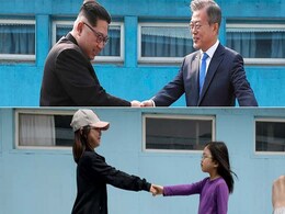 Tourists Re-Enact Famous North And South Korea Handshake At Replica Border Village Tourists Re-Enact Famous North And South Korea Handshake At Replica Border Village