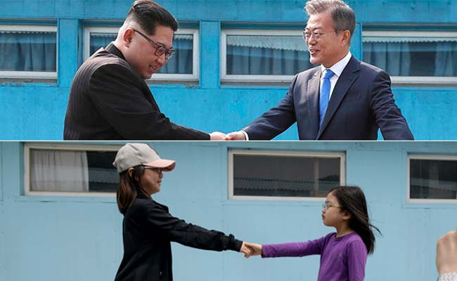 Tourists Re-Enact Famous North And South Korea Handshake At Replica Border Village