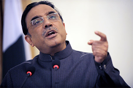 Zardari gives in to Taliban, signs Islamic law