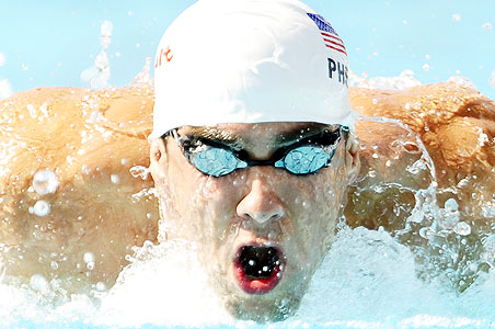 Cavic wins 50 fly and warns Phelps for 100