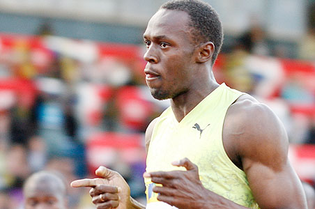 Bolt wins 100, Isinbayeva loses in pole vault
