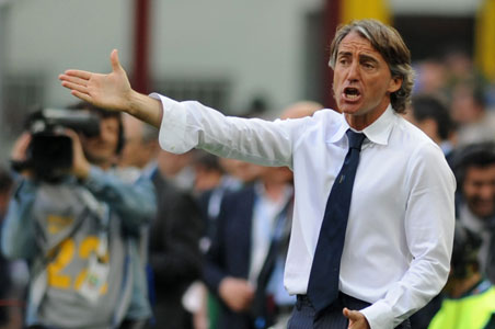 Man City fires manager Hughes, hires Mancini