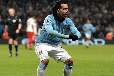 Tevez treble guides City into fourth place