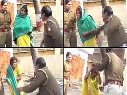 Cop fired for beating Dalit woman on camera Cop fired for beating Dalit woman on camera