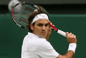 Federer squeezes into third round
