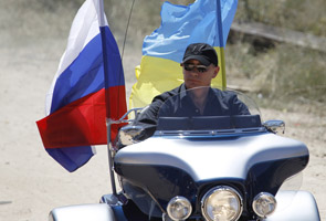 Russia PM Putin rides Harley Davidson at motorcycle show