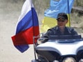 Russia PM Putin rides Harley Davidson at motorcycle show