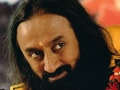 NRI accuses Sri Sri Ravishankar of grabbing land