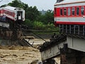 China train falls in river after bridge collapse