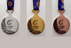 Kalmadi unveils CWG medals, hopes windfall for Indians