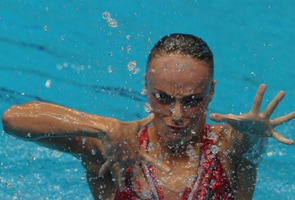 Boudreau-Gagnon keeps solo synchro crown in swimming