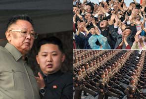 N Korea's Kim, heir apparent son at lavish parade  