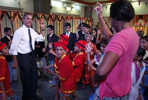 The Obamas charm with their fisherfolk dance