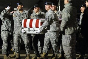 Rogue Afghan cop's victims return home in caskets