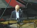 Putin sings, plays piano at charity event