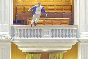 Romanian man jumps off Parliament's balcony