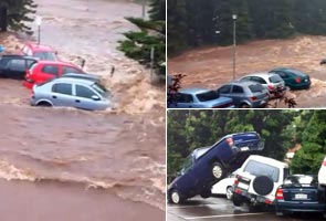 Cars washed away in flooded creek caught on camera