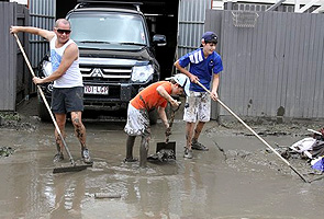 Soaked Australia focuses on flood cleanup