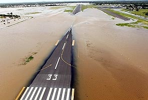 Australian planes rush in aid as floods continue