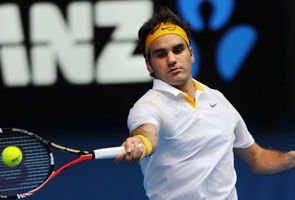 Record win for Federer as Henin crashes