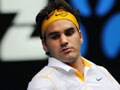 Record win for Federer as Henin crashes