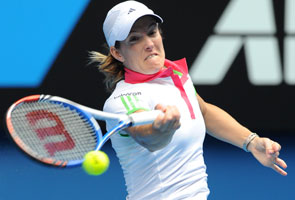 Positive Henin stays on track