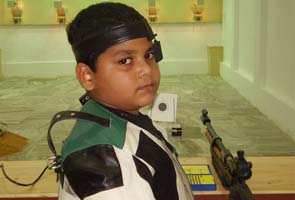 This 10-year-old has a gun in his hand