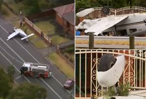 Passengers walk away after aircraft crashes on street